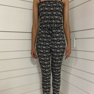 a black and white off the shoulders jumpsuit